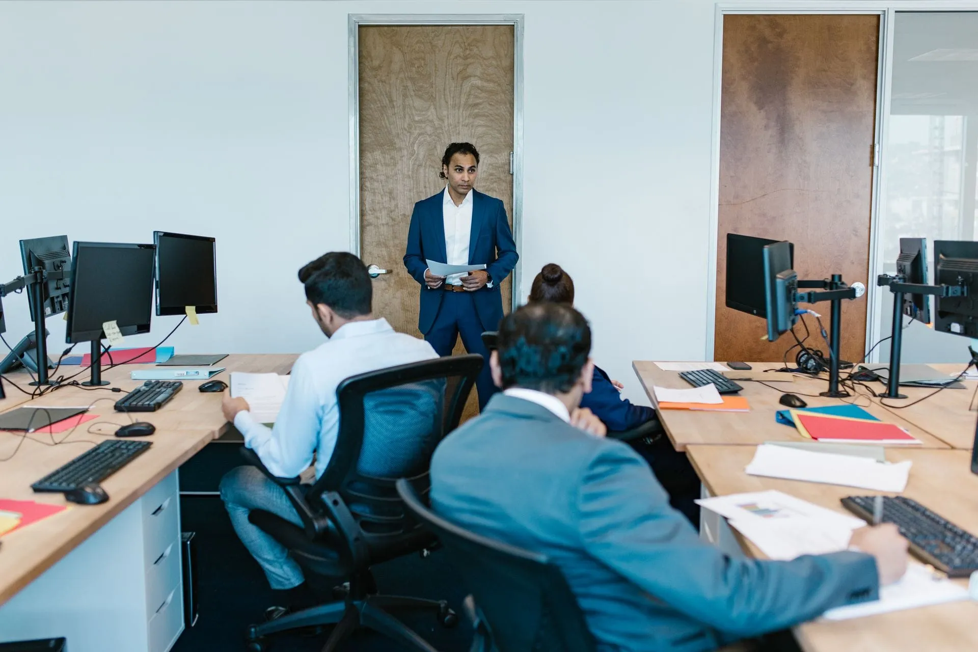 Indian professionals in a business presentation in a modern office